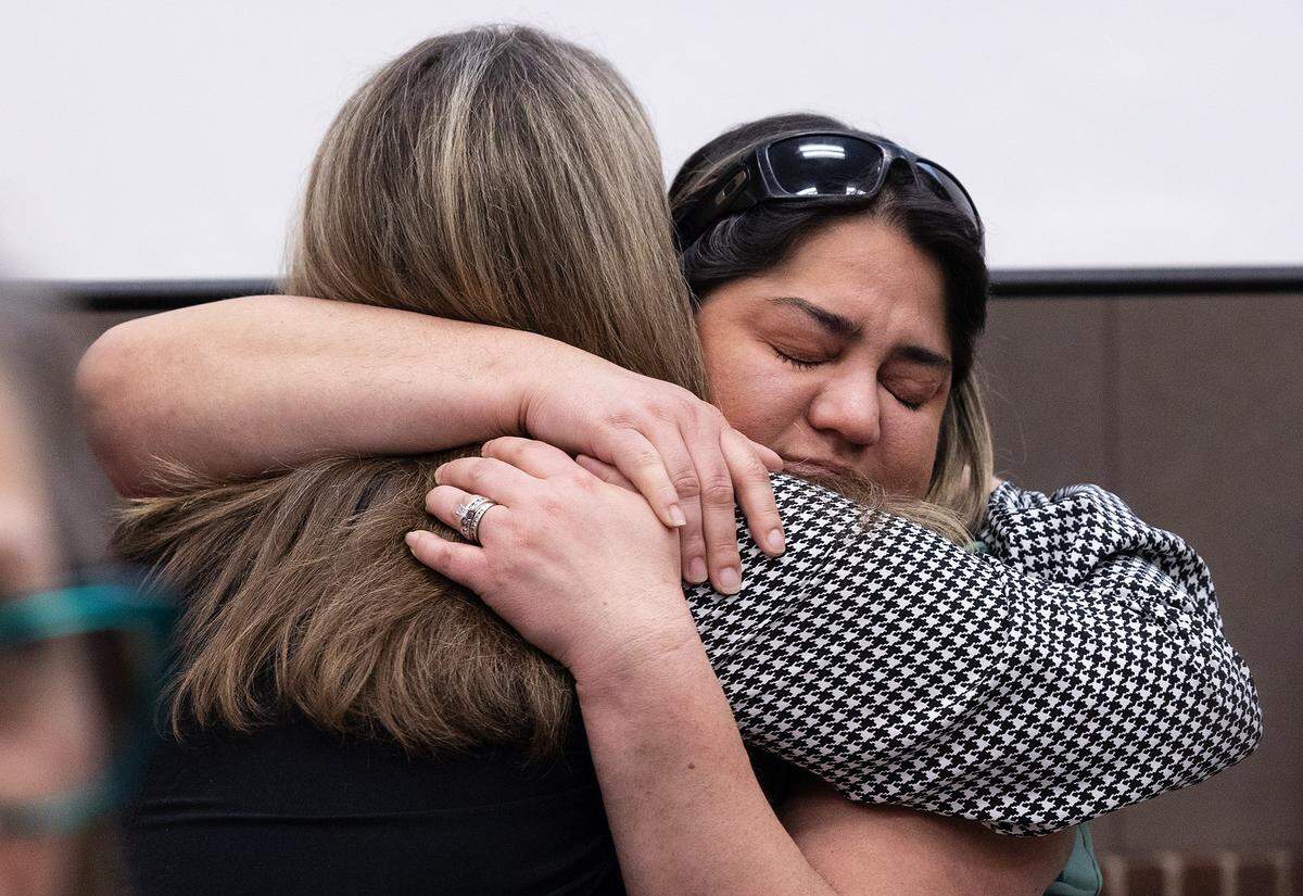 Jessica Roberts, right, hugs her cousin Candice Lester at a press conference on Monday, Nov. 17, 2025, to announce the arrest of a suspect in the1991 murder of her mother, Cynthia Gonzalez. An arrest was made with the help of UTA's Department of Criminology & Criminal Justice class.