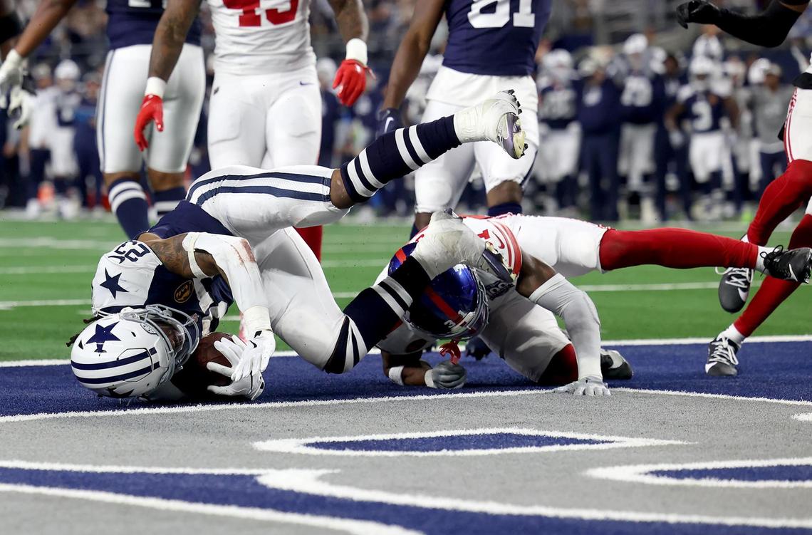 Dalals Cowboys running back Rico Dowdle scores a touchdown against the New York Giants on Thursday, Nov. 28, 2024, at AT&T Stadium in Arlington.