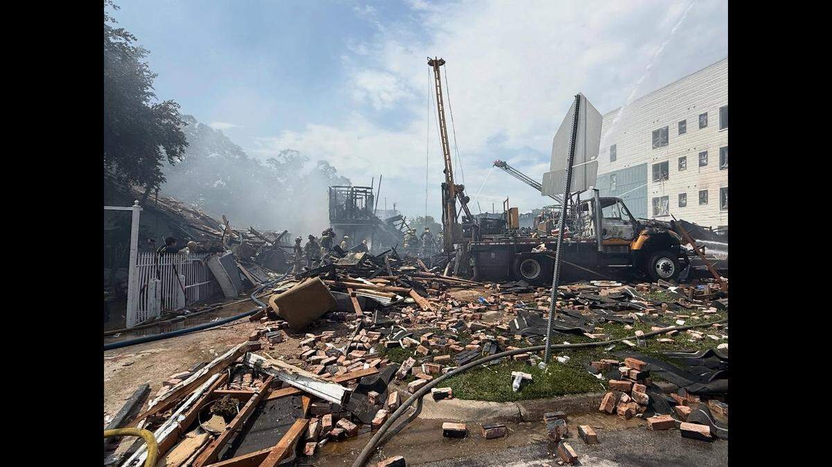 Dallas Fire-Rescue crews work at the scene of an apartment building explosion near Oak Cliff on Thursday May 28, 2026.