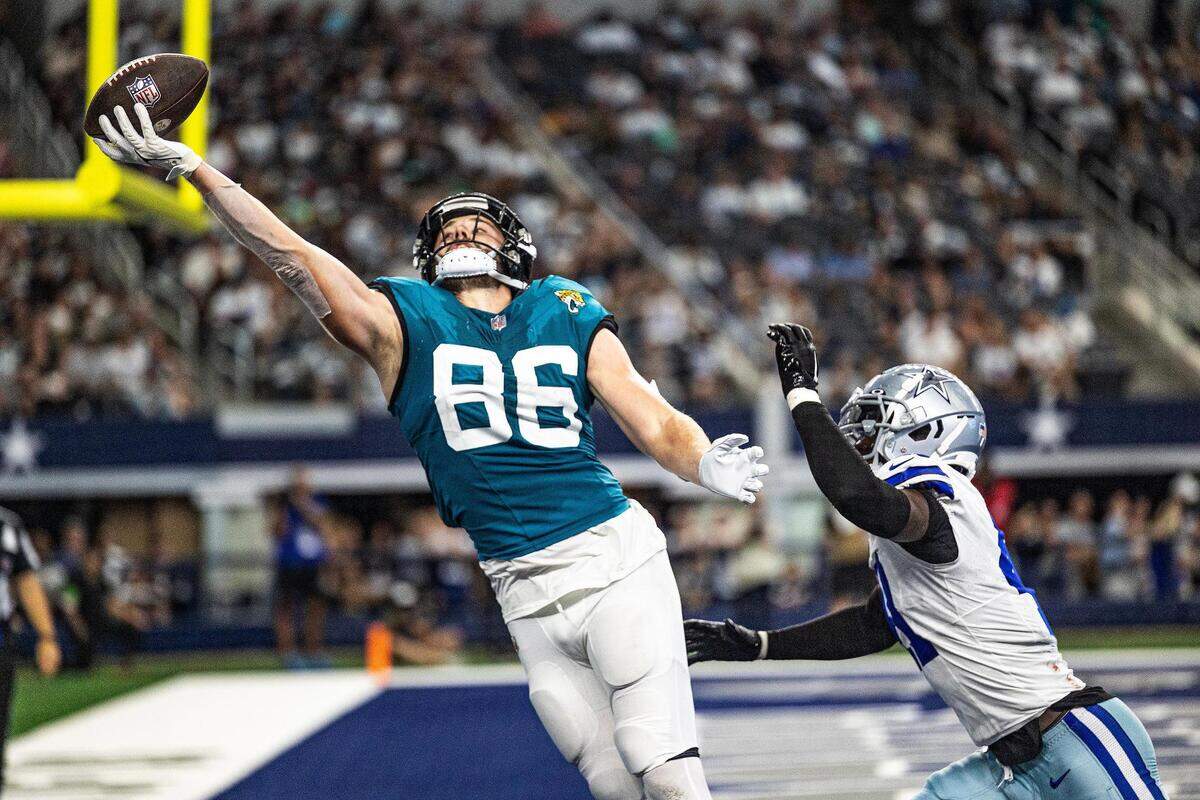 Jacksonville Jaguars tight end Gerrit Prince (86) reaches for the ball with one hand in the end zone in the third quarter during the first preseason game between the Dallas Cowboys and Jacksonville Jaguars at AT&T Stadium in Arlington, Texas on Saturday, Aug. 12, 2023.
