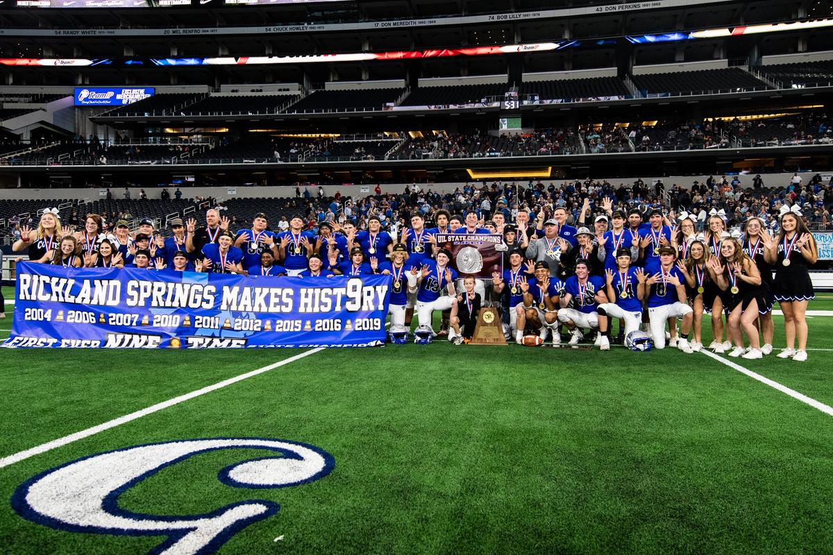 Richland Springs Coyote football and the chherleaders pose with thee championship trophy after defeating Matador Motley County 62-16 in 3 quarters in Arlington, at AT&T Stadium on December 18, 2019. Photo by Matt Smith (Special to the Star-Telegram).