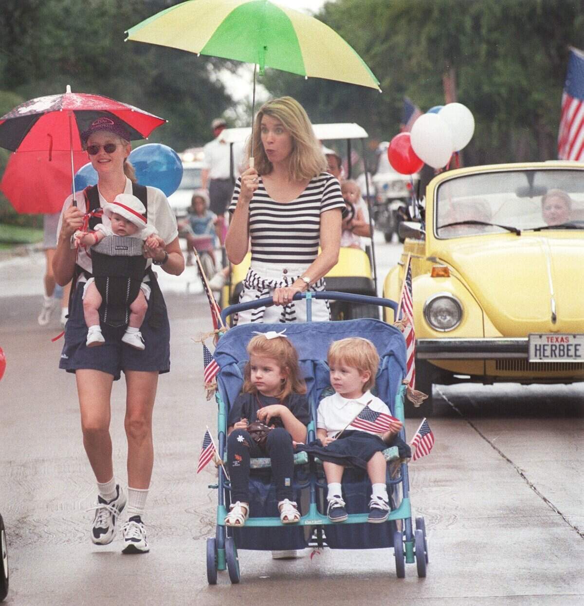Sept. 6, 1999: It rained on the Crestline Area Neighborhood Association’s annual Labor Day parade. Lauren Puff, left brought an umbrella to keep daughter Anna dry, as did Dana Kelly for her children, Lynn and Patrick. The parade was completed, but a concert by the Paschal High School Stage Band after the parade was canceled because of rain.