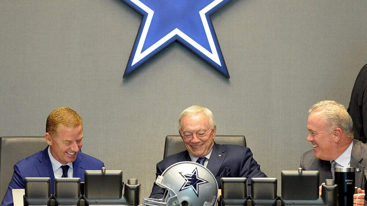 Dallas Cowboys owner Jerry Jones, center, talks with head coach Jason Garrett, left, and Stephen Jones in the Dallas Cowboys Draft War Room at Ford Center at The Star in Frisco during the 2017 draft. The Cowboys will have the 19th overall pick in the 2018 draft.