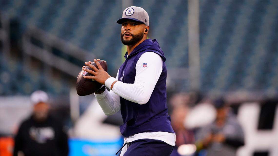 Dallas Cowboys’ Dak Prescott warms up before Sunday’s game in Philadelphia. He was inactive for the game, but could return next week against Detroit.