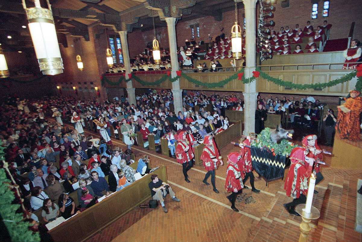 Expect a full house at the annual Boar’s Head and Yule Log Festival at University Christian Church, where Beefeater guards in bright red jackets lead the procession carrying an actual boar’s head down the aisle. This photo is from the 1998 pageant. It hasn’t changed a bit.