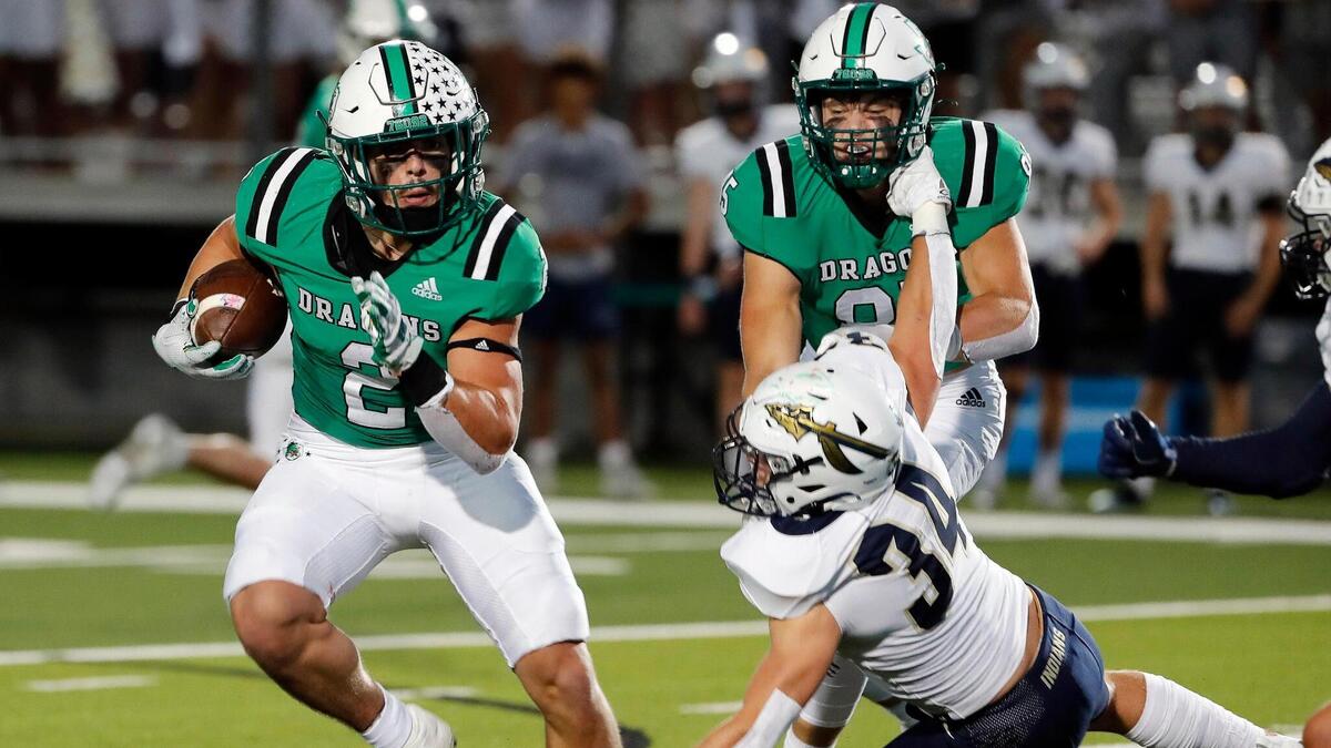 Southlake Carroll running back Owen Allen (2) avoids the tackle of Keller linebacker Parker Knowles (34) in the first half of a District 4-6A high school football game at Dragon Stadium in Southlake, Texas, Friday, Oct. 07, 2022. Keller led Carroll by four at the half. (Special to the Star-Telegram Bob Booth)
