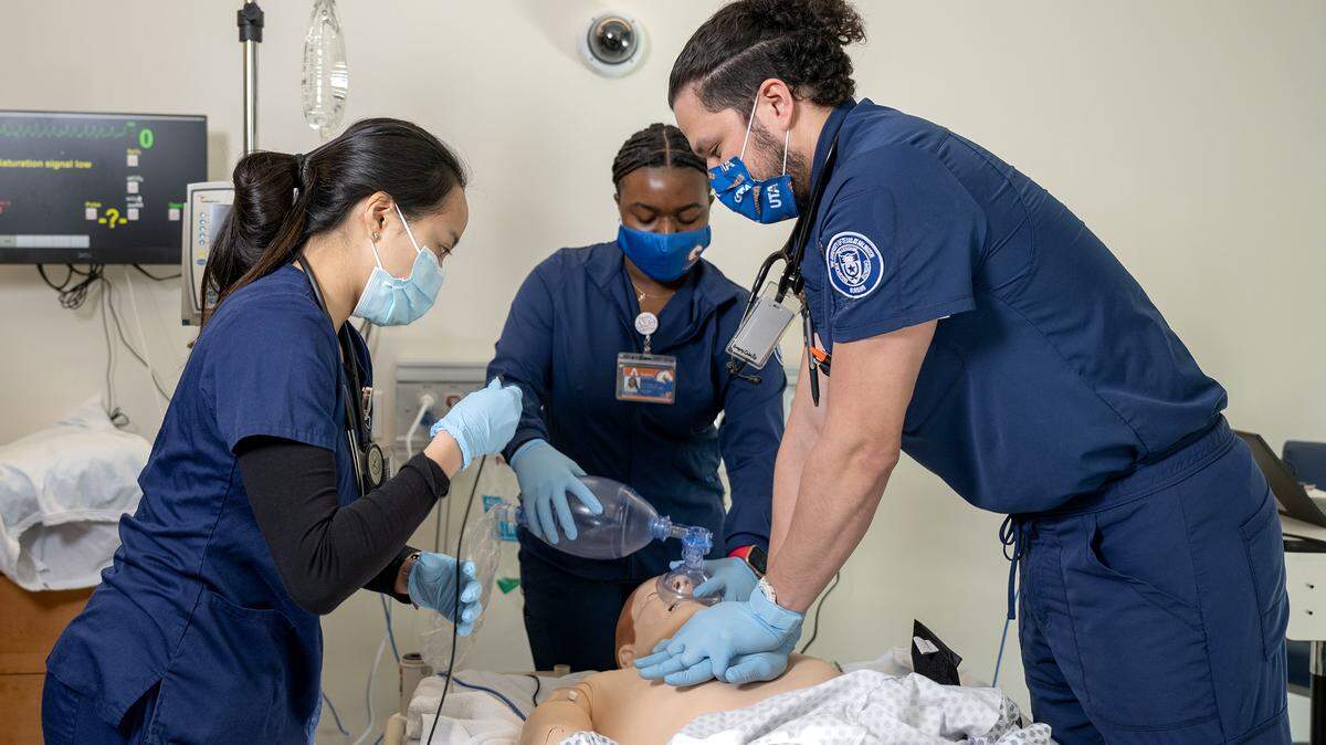 Nursing students at the University of Texas at Arlington react to a “code blue” medical emergency on a mannequin. The university produces more baccalaureate-educated nurses than any other program in Texas. 