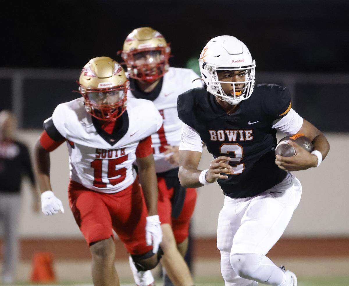 Bowie quarterback Jayden Bibbs (2) earns a first down with a run up the middle during the second half of a UIL football game between South Grand Prairie and Arlington Bowie at UTA Maverick Stadium in Arlington, Texas, Thursday Nov. 06, 2025.