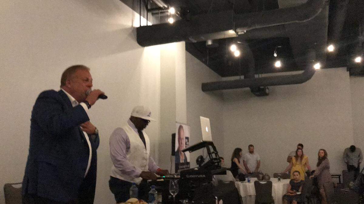 Arlington Mayor-elect Jim Ross steps on stage during his campaign party at Live! by Loews on Saturday after maintaining a comfortable lead in his runoff.