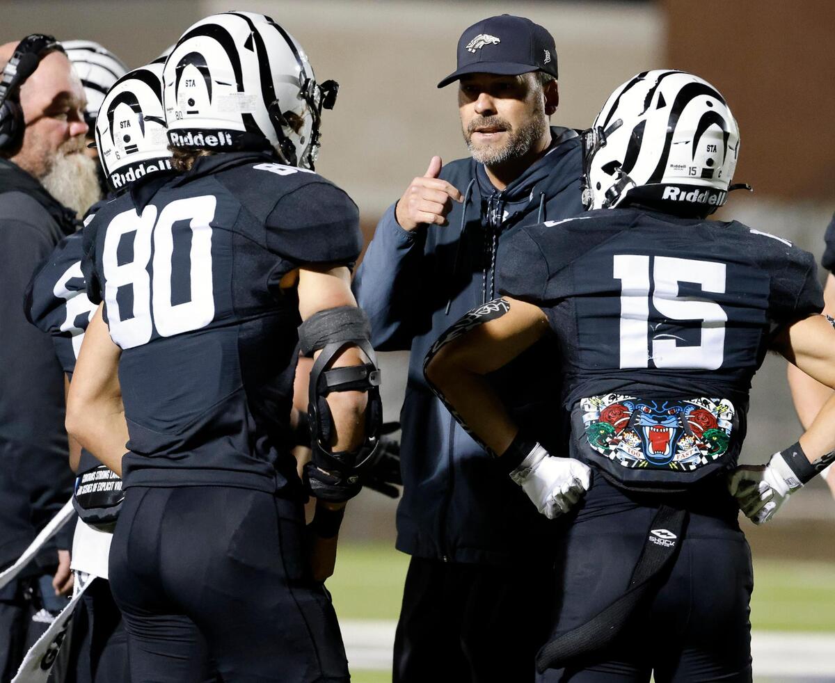 Grandview head coach Ryan Ebner talks to his team during a timeout during a UIL Class 3A Division 1 area round playoff football game at Mesquite Memorial Stadium in Mesquite, Texas, Thursday, Nov. 16, 2023.
