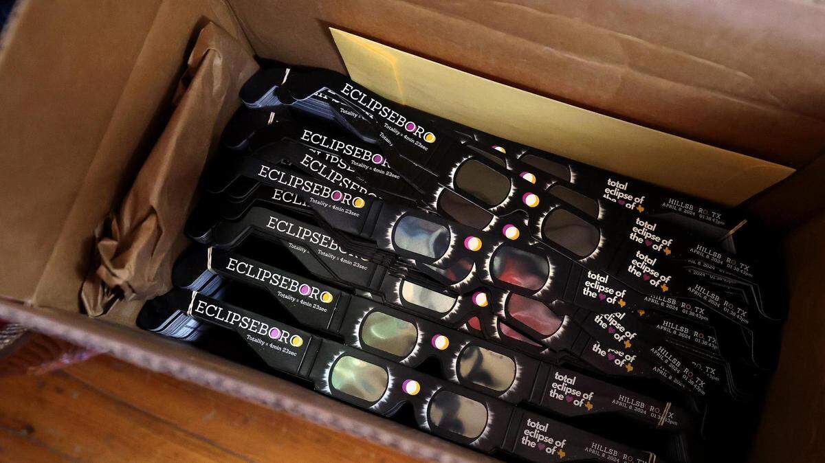 A box of Eclipseboro branded solar eclipse glasses sits ready at the Hillsboro Chamber of Commerce on Thursday, February 22, 2024. The city and chamber of commerce have ordered around 50,000 pairs in preparation for the total solar eclipse.