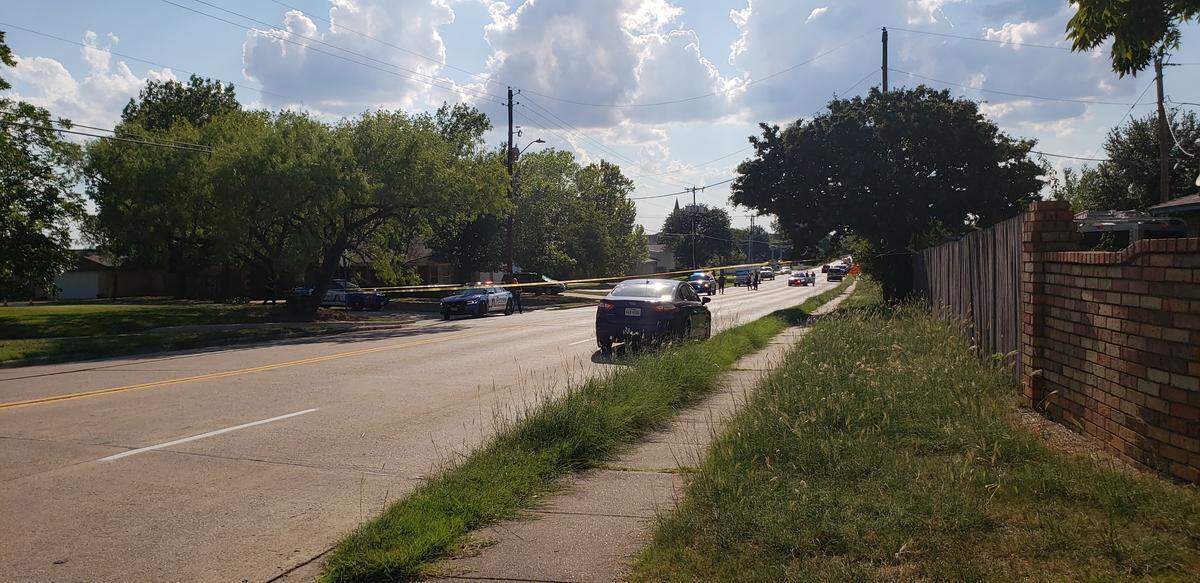 An Arlington police officer trapped in a SUV’s window shot a man while he was driving away a traffic stop, according to police.