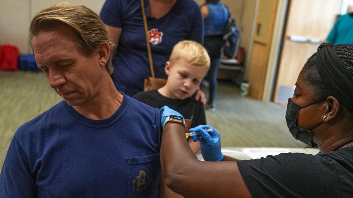Christopher Garrison gets a flu shot at the second annual Austin Independent School District Showcase at the Palmer Events Center on Sep. 23, 2023 in Austin. Families attending the event were able to sign up for a free updated flu shot on the second floor of the Palmer Events Center.
