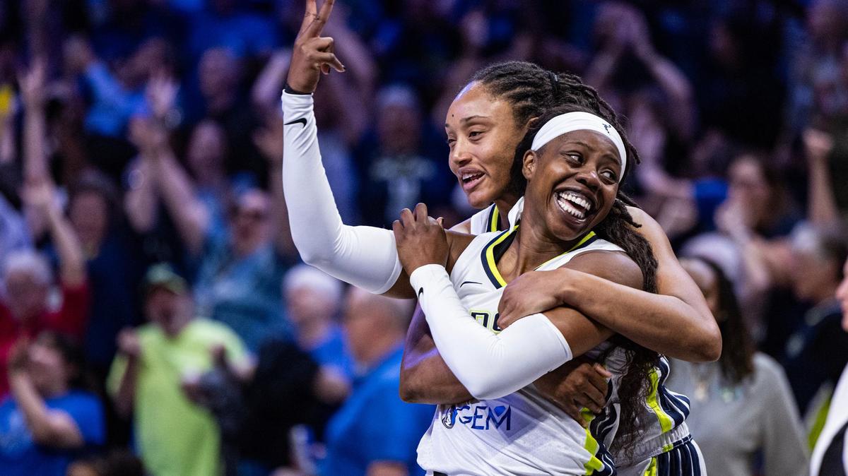 Dallas Wings guard Arike Ogunbawale (24) celebrates with her teammate Jaelyn Brown (18) after making the game-winning, three-point shot in the fourth quarter of a WNBA preseason game between the Dallas Wings and Indiana Fever at College Park Center in Arlington on Friday, May 3, 2024.