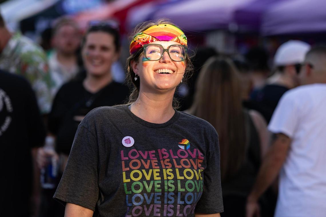 Fort Worth resident Sara Beckham walks past vendors during the Trinity Pride Fest on South Main Street in Fort Worth on Saturday, June 28, 2025.