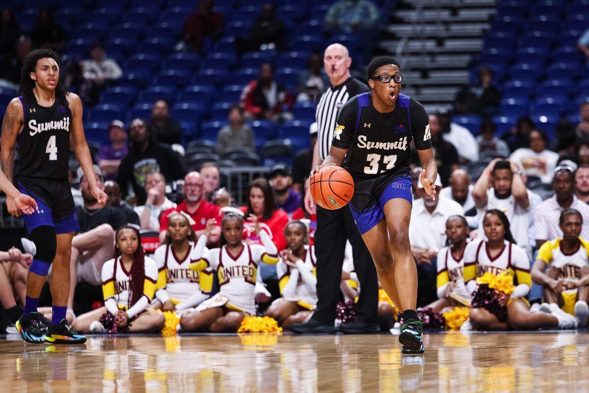 Mansfield Summit guard Javon Ross (33) runs while holding the ball in disbelief after a foul call in the Class 5A Division II state championship against Beaumont United at The Alamodome in San Antonio, Texas, March 14, 2026.
