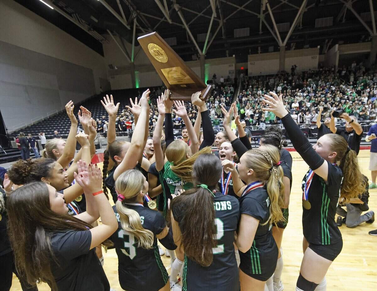 Southlake Carroll Lady Dragons celebrate after defeating Austin for the UIL Class 6A Division II state volleyball championship game Saturday Nov. 22, 2025 at Curtis Culwell Center in Garland, Texas.