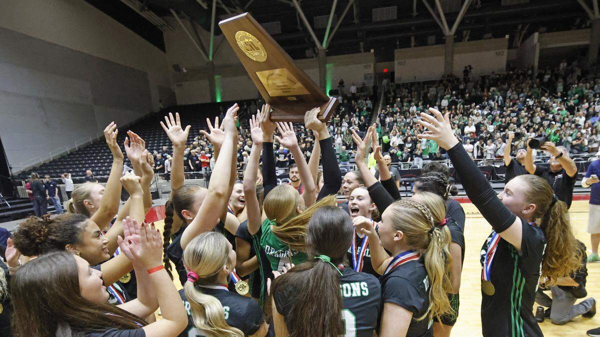 Southlake Carroll Lady Dragons celebrate after defeating Austin for the UIL Class 6A Division II state volleyball championship game Saturday Nov. 22, 2025 at Curtis Culwell Center in Garland, Texas.
