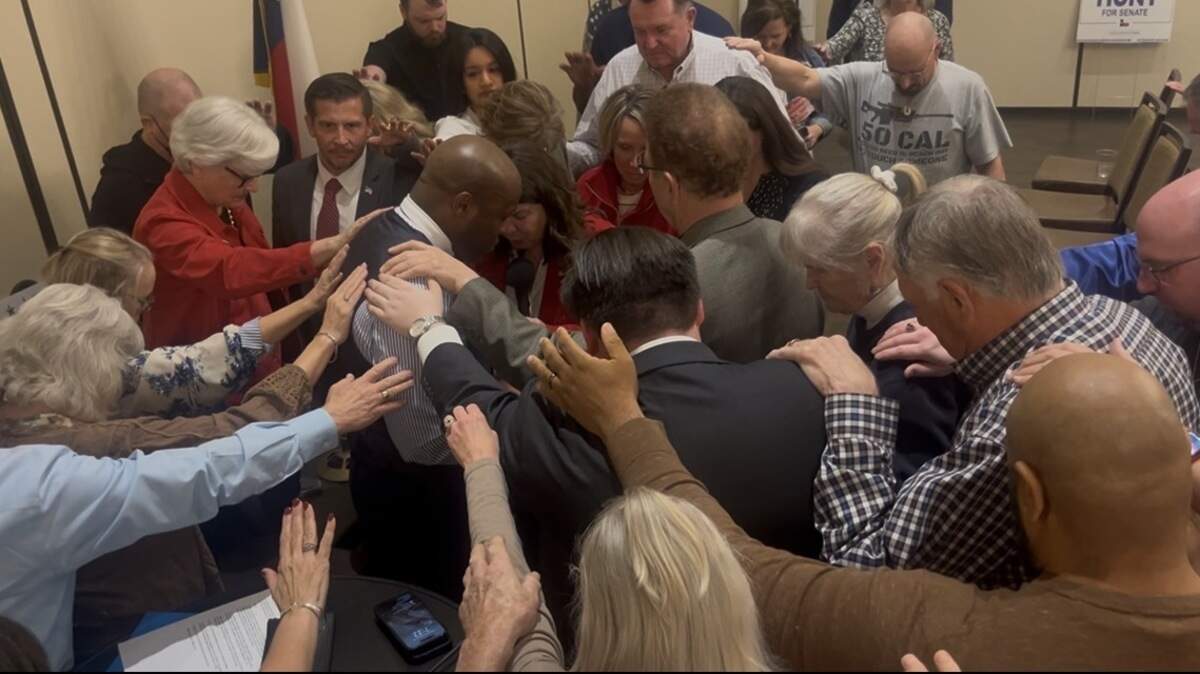 U.S. Rep. Wesley Hunt, who is running for a senate seat in the 2026 midterm elections, prayed with voters at an event in Denton Feb. 18.