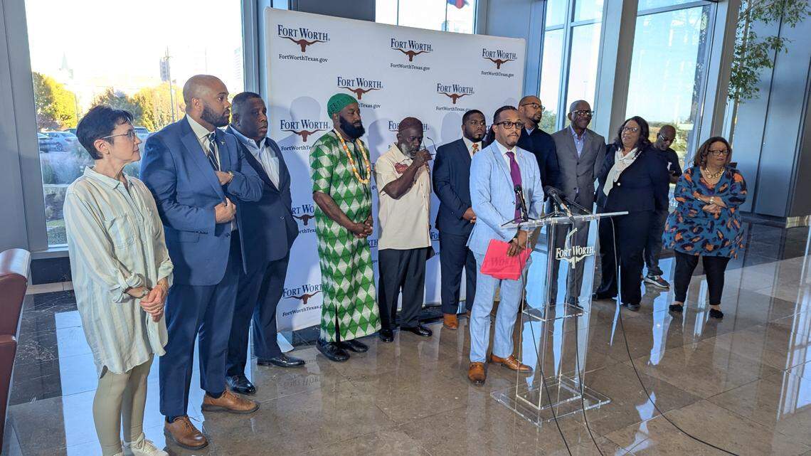 Bunch of people in behind a podium with a city of Fort Worth logo backdrop