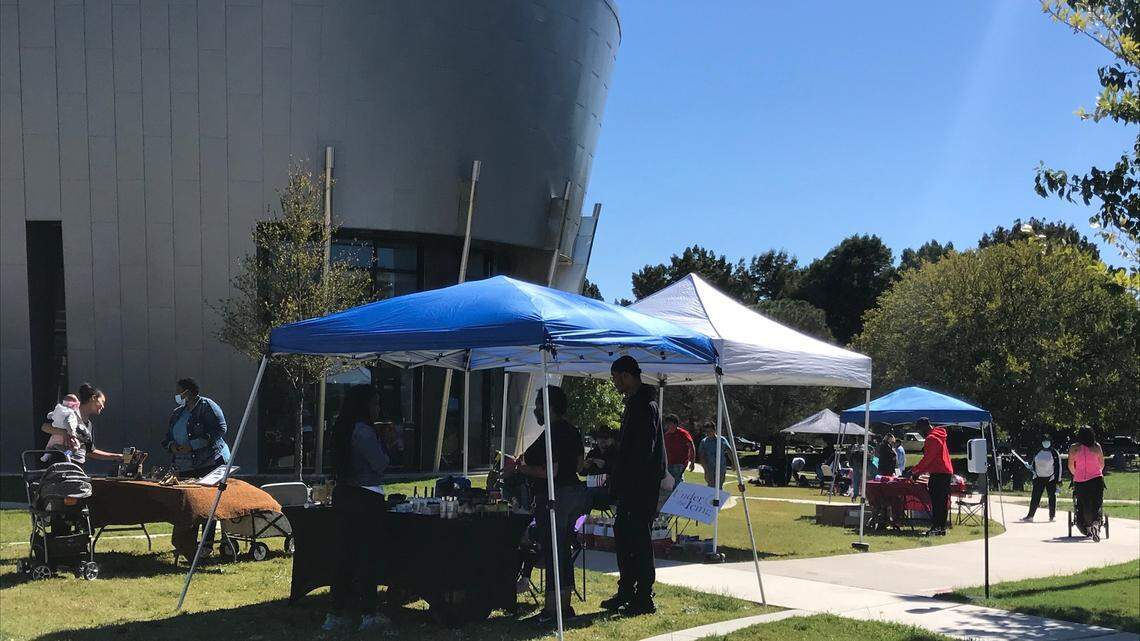 Vendors sell goods and offer services at the Eastside Exchange, a monthly community market outside East Library and Recreation Center at Bob Cooke Park in Arlington Saturday, Oct. 16, 2021.