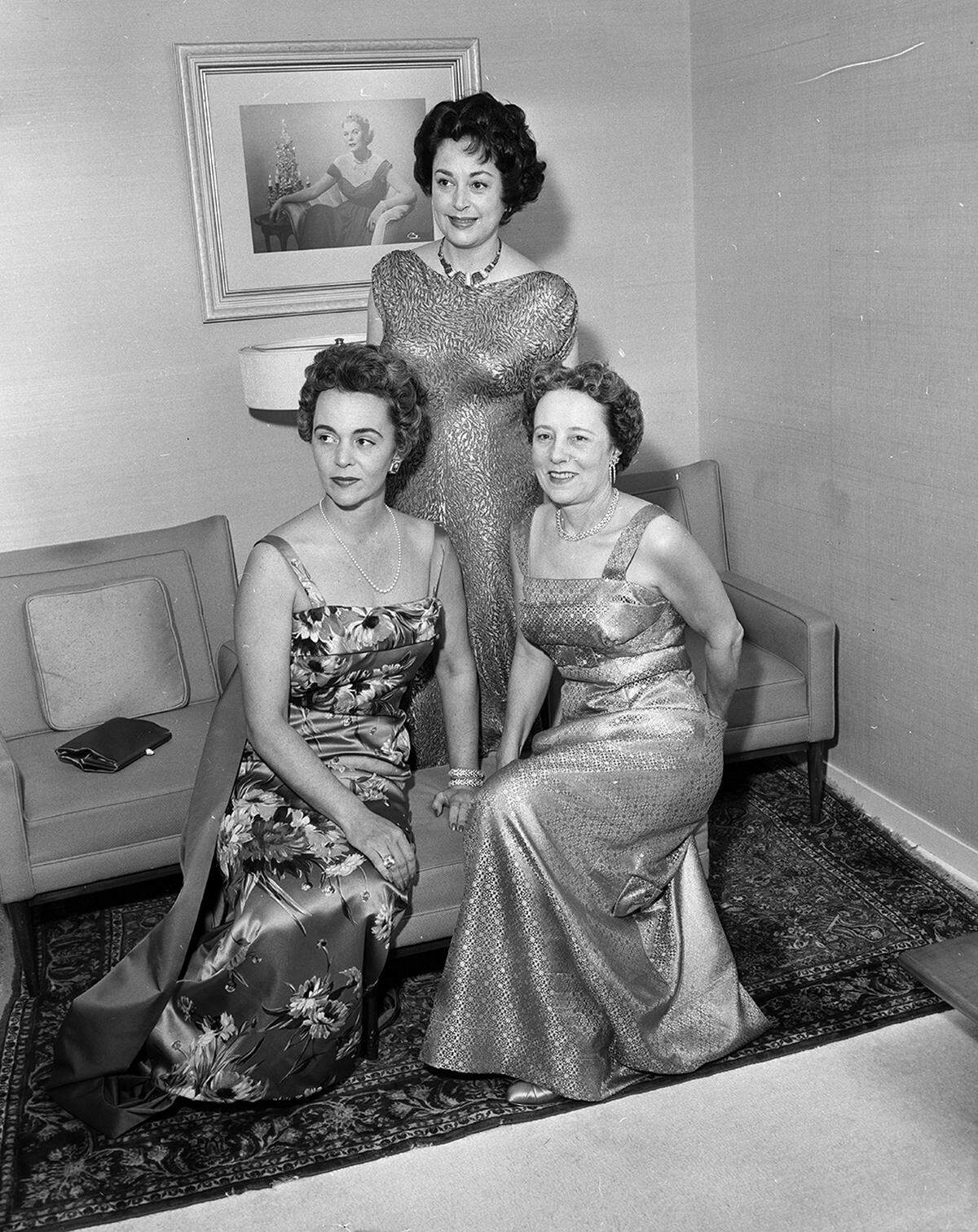Guests at a pre-ball party were Mrs. William Fielder, left, Mrs. Pio Crespi, right, and Mrs. Jake Hamon, standing, all from Dallas. They were all guests of Mr. and Mrs. Robert F. Windfohr’s at Assembly Ball sometime in the 1950s.