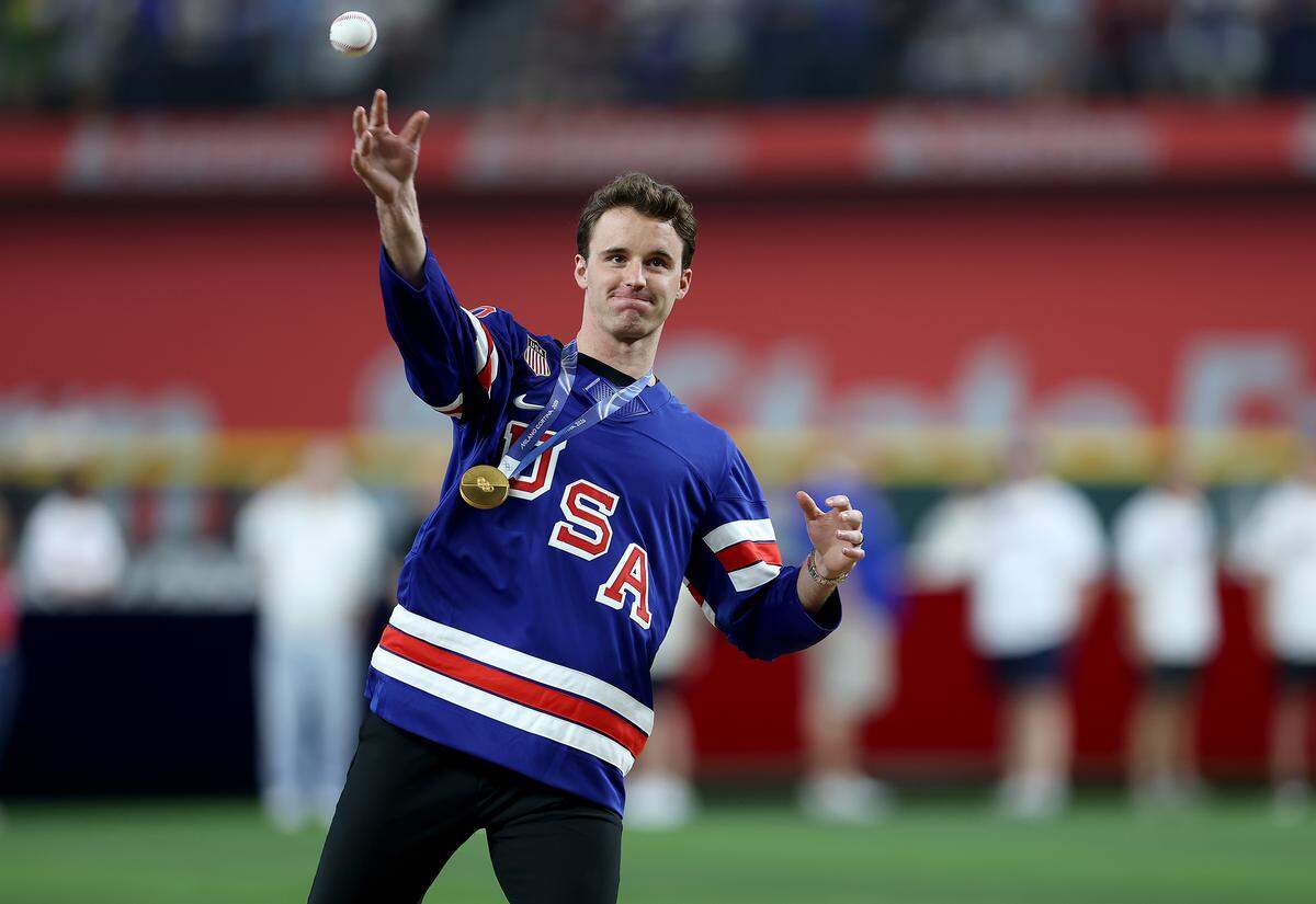 Dallas Stars goaltender and Olympic gold medalist Jake Oettinger throws the ceremonial first pitch before the start of the Texas Rangers’ home opener against the Cincinnati Reds on Friday, April 3, 2026, at Globe Life Field.