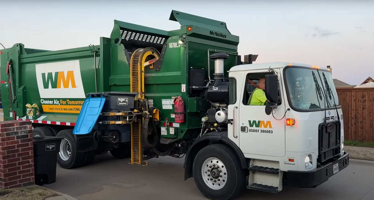 A WM collection truck makes its rounds.