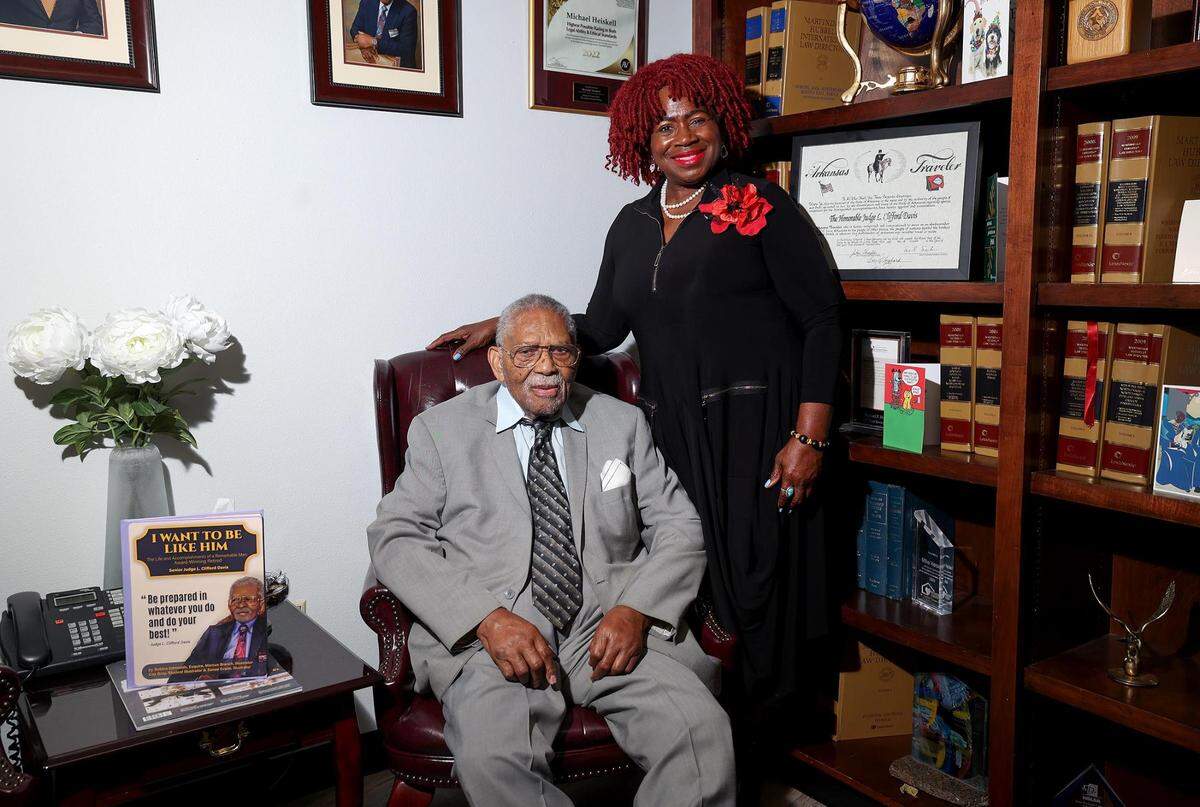 Judge L. Clifford Davis is photographed with Bobbie Edmonds, a local attorney who released a book about Davis’ life.