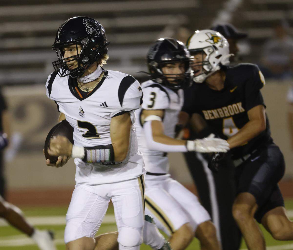 Eagle Mountain quarterback Brycen Vindiola (2) breaks out the left side during the first half of a UIL football game between Eagle Mountain and Benbrook at Farrington Field in Fort Worth, Texas, Friday, Sept. 26, 2025.