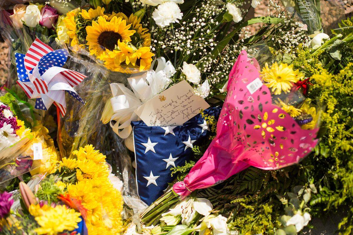 Flowers and items left at a makeshift memorial near the Walmart where 20 people were killed Saturday, in El Paso, Texas, Aug. 4, 2019. Federal investigators in El Paso said they were treating the shooting as an act of domestic terrorism and prosecutors were considering federal hate crime charges. (Celia Talbot Tobin/The New York Times)