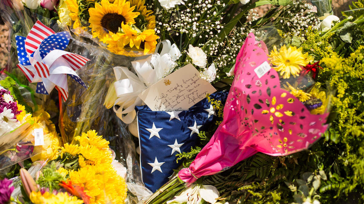 Flowers and items left at a makeshift memorial near the Walmart where 20 people were killed Saturday, in El Paso, Texas, Aug. 4, 2019. Federal investigators in El Paso said they were treating the shooting as an act of domestic terrorism and prosecutors were considering federal hate crime charges. (Celia Talbot Tobin/The New York Times)