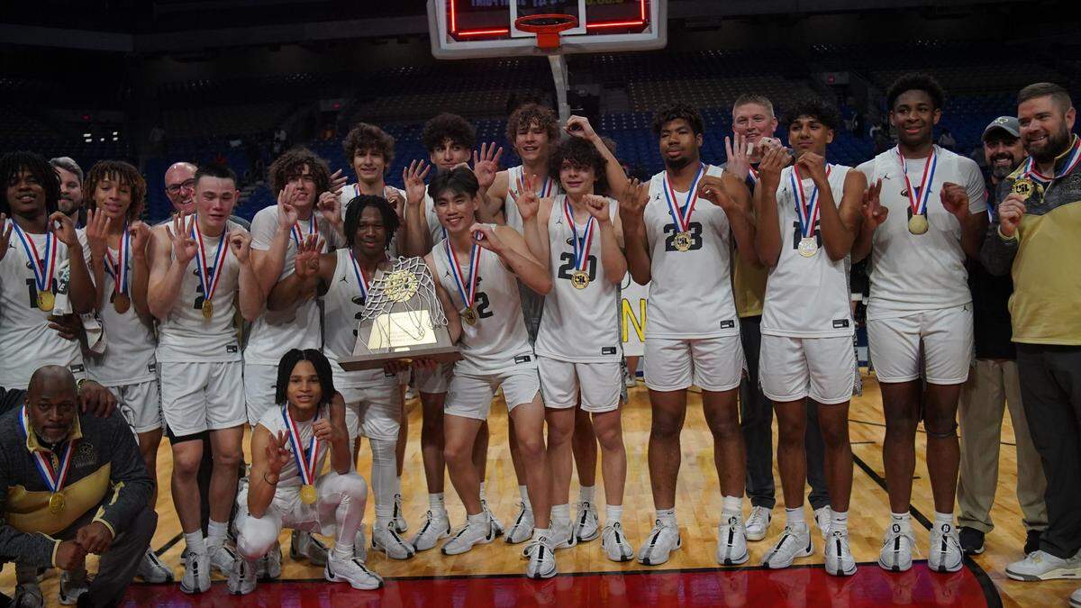 The Plano East Panthers pose with their hardware after defeating Round Rock Stony Point in the Class 6A state championship game on Saturday, March 9, 2024 at the Alamodome in San Antonio, Texas. Plano East defeated Stony Point 53-41.