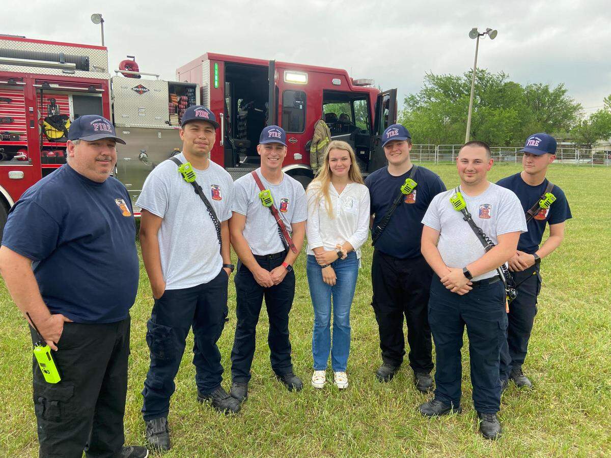 Legacy’s Savannah Stewart pictured with first responders that helped save her after a car crash in November (Sherrie Stewart/Courtesy)