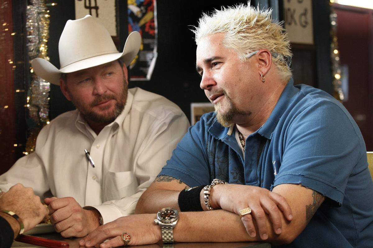 On a January 6, 2008 visit, host Guy Fieri of “Diners, Drive-Ins and Dives” talks with patron Matt Blevins at the original Fred’s Texas Cafe location on Currie Street.