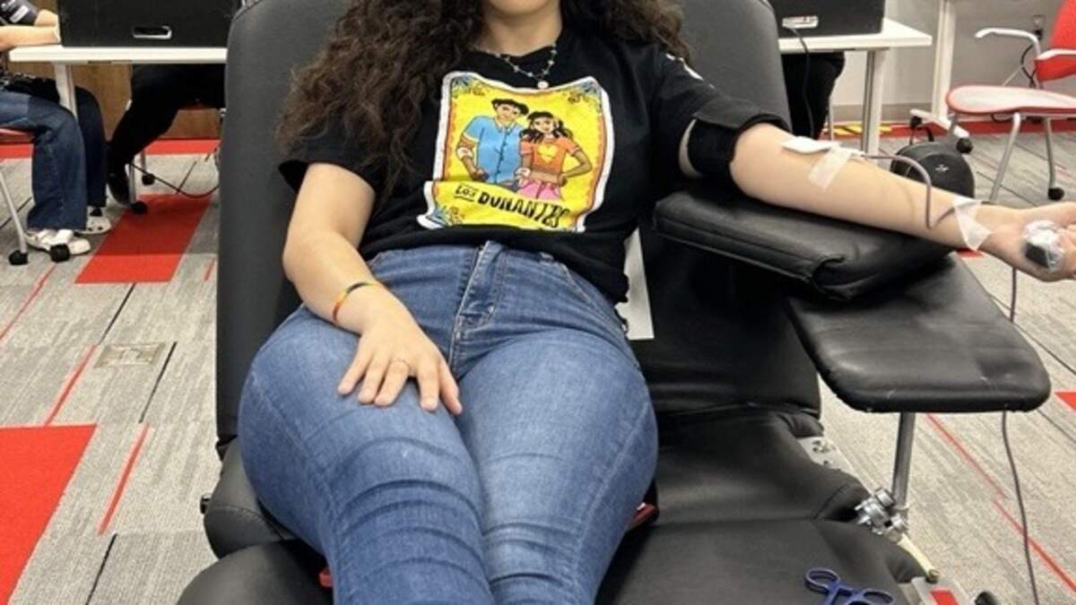 Alexis Gonzalez donating blood with The American Red Cross.