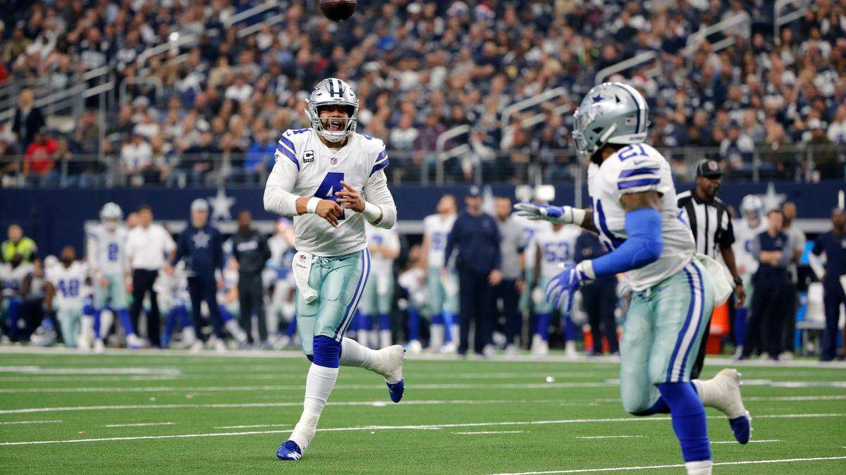 Dallas Cowboys quarterback Dak Prescott (4) throws a pass to running back Ezekiel Elliott (21) during an NFL football game, Sunday, Dec. 23, 2018, in Arlington, Texas. (AP Photo/Michael Ainsworth)