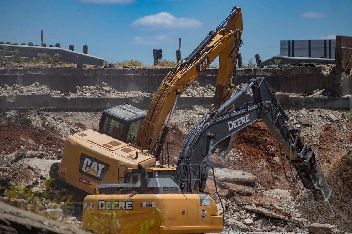 Demolition begins for the southbound Loop 820 bridge crossing over Texas 121 in Fort Worth, Texas, on Saturday, July 16, 2022. Multiple detours bypassed motorists around the ongoing construction.