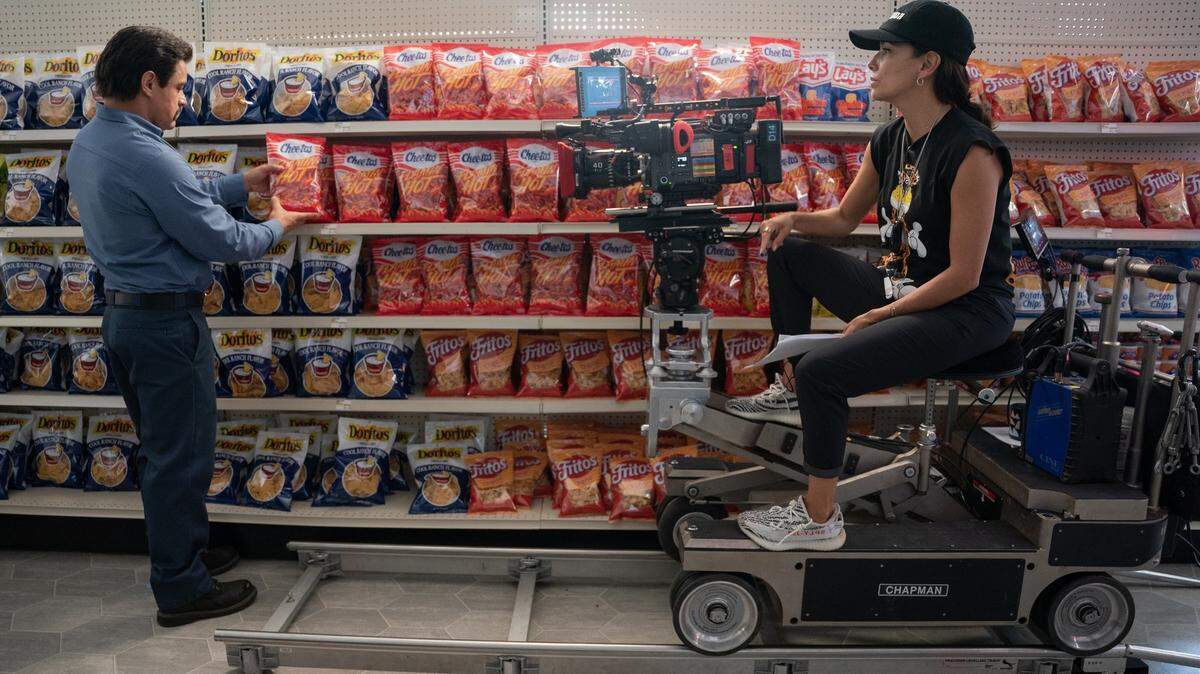 Jesse Garcia and Eva Longoria on the set of FLAMIN’ HOT. Photo by Emily Aragones. Courtesy of Searchlight Pictures. © 2023 20th Century Studios All Rights Reserved.