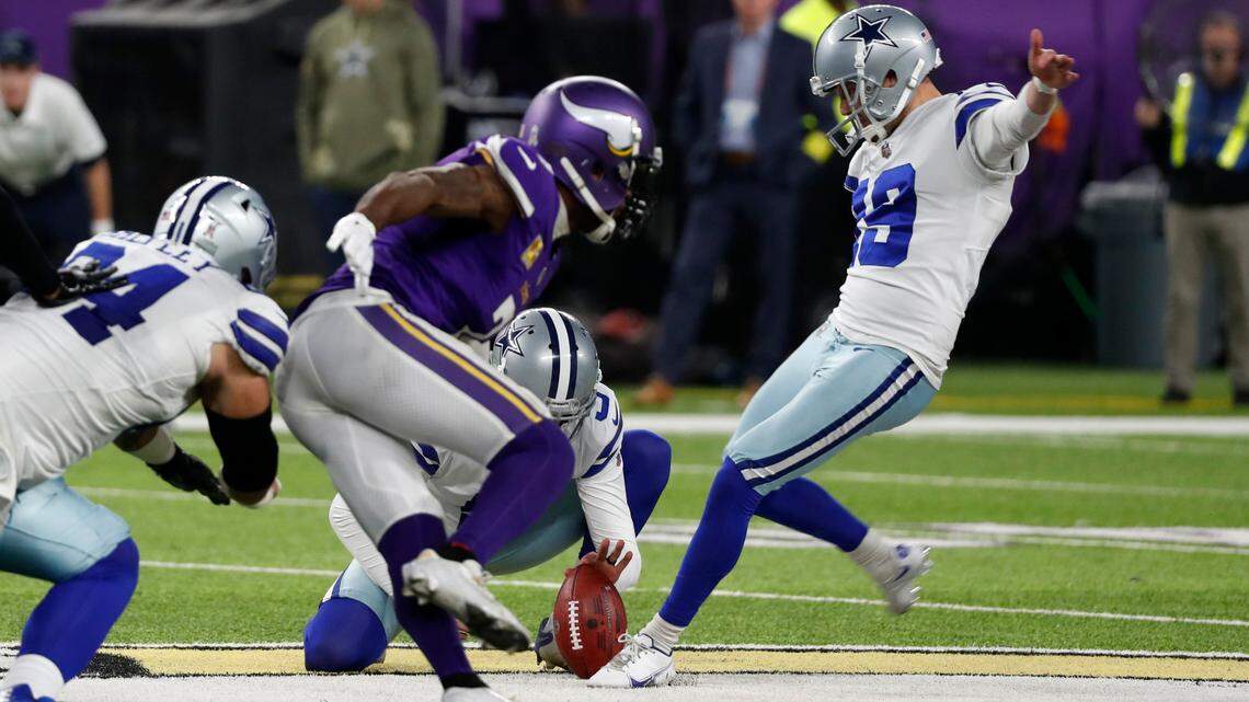 Dallas Cowboys place kicker Brett Maher, right, kicks a 60-yard field goal during the first half of an NFL football game against the Minnesota Vikings, Sunday, Nov. 20, 2022, in Minneapolis. (AP Photo/Bruce Kluckhohn)