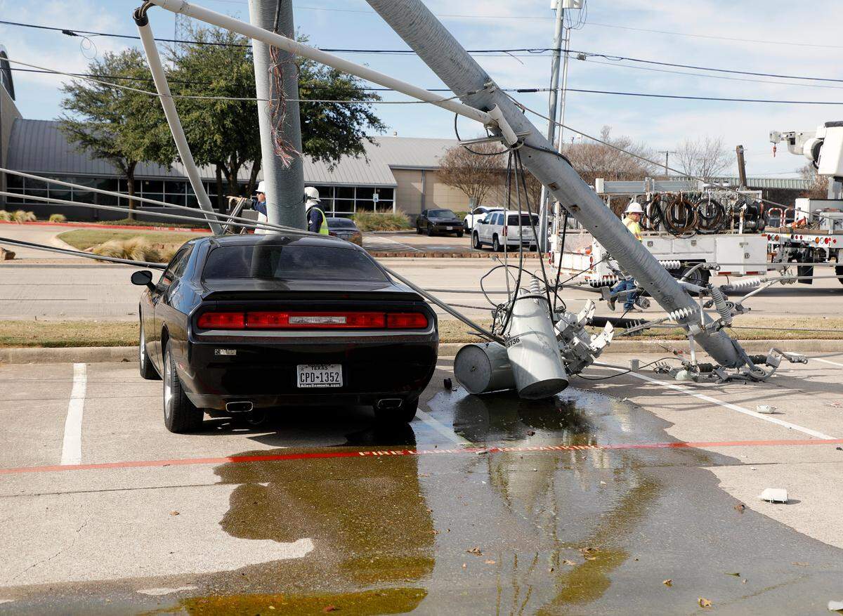 An electricity main feeder pole and transformers lay in a parking lot next to a car in Hurst on Tuesday. The accident downed one pole and damaged three others along Precinct Line. The emergency power generator and switch was damaged at the fire house. It also broke water pipes and flooded the building. No one other than the driver was injured. According to two Oncor reps, power should be restored by late Tuesday night or Wednesday morning.