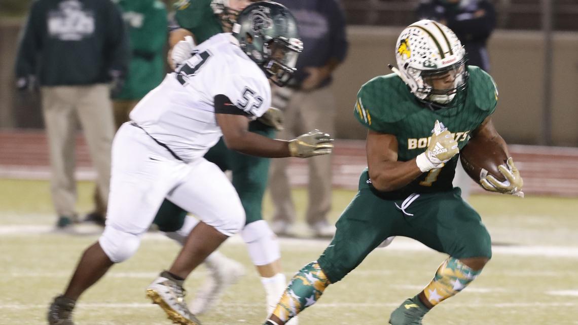 Benbrook running back Quintan Jackson breaks away from Kennedale defensive tackle Jordan Price (52) in the first half of a high school football game at Clark Stadium in Fort Worth, Texas, Thursday, Nov. 01, 2018. Kennedale led 29-7 at the half. (Special to the Star-Telegram Bob Booth)