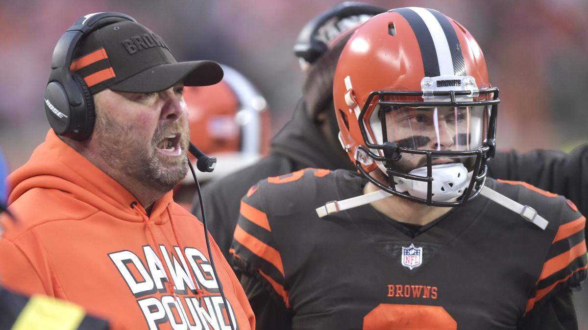 Cleveland Browns offensive coordinator Freddie Kitchens, left, talks with quarterback Baker Mayfield (6) in the fourth quarter of an NFL football game against the Cincinnati Bengals, Sunday, Dec. 23, 2018, in Cleveland. The Browns won 28-16. (AP Photo/David Richard)