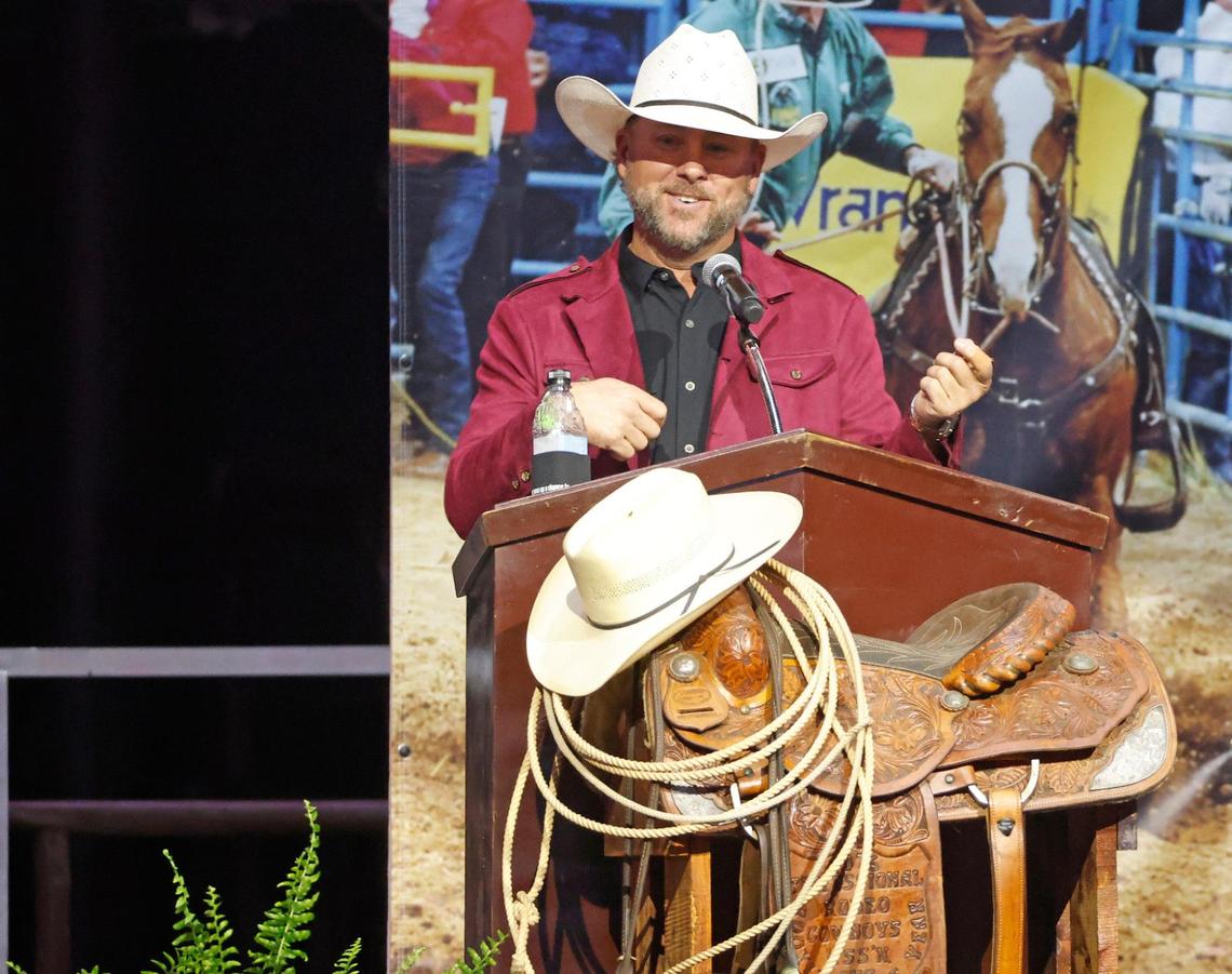 Trevor Brazile recounts some memories with the audience during a memorial service for world champion calf roper Roy Dale Cooper at Cowtown Coliseum in Fort Worth on Monday.