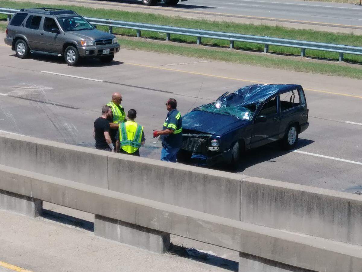 A rollover crash Tuesday afternoon flattened the top of this car, but two occupants received only minor injuries.