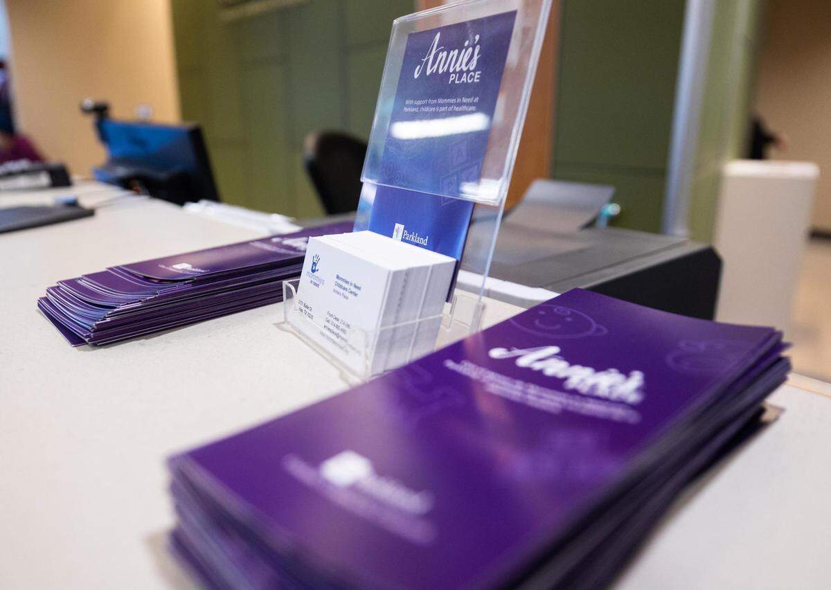 Flyers for Annie’s Place are displayed on the check-in counter at the Wish Center at Parkland Memorial Hospital in October.