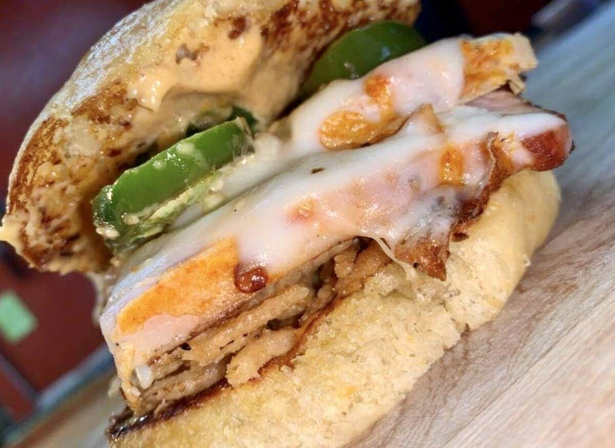 The “Gobble,” a smoked turkey special at BBQ on the Brazos, has mozzarella, onion strings and chipotle mayo.