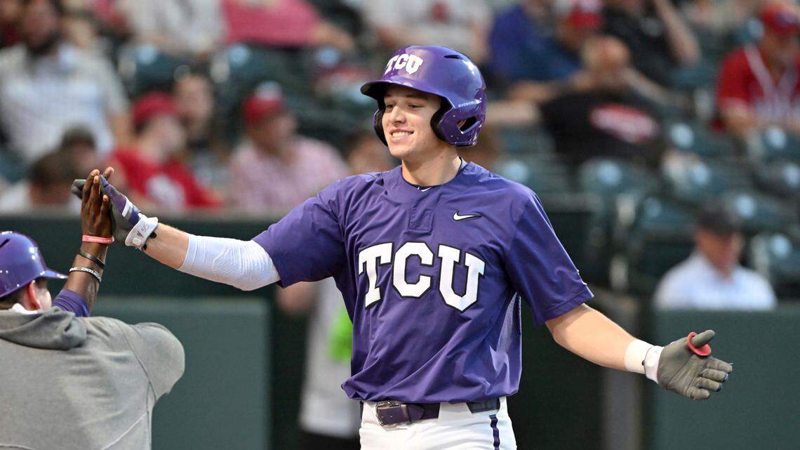 TCU batter Brayden Taylor is greeted by teammates after hitting home run against Arizona during the NCAA regional. He has a school-record 45 home runs in his career.