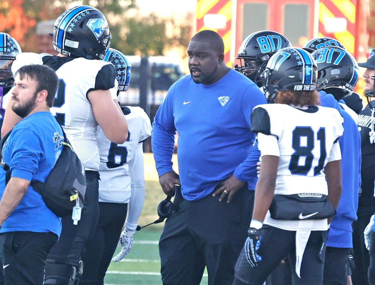 North Crowley head coach Ray Gates talks to players during a time out during the UIL District 6A D1 Regional football game at Vernon Newsom Stadium in Mansfield, Texas, Saturday, Nov. 30, 2024.