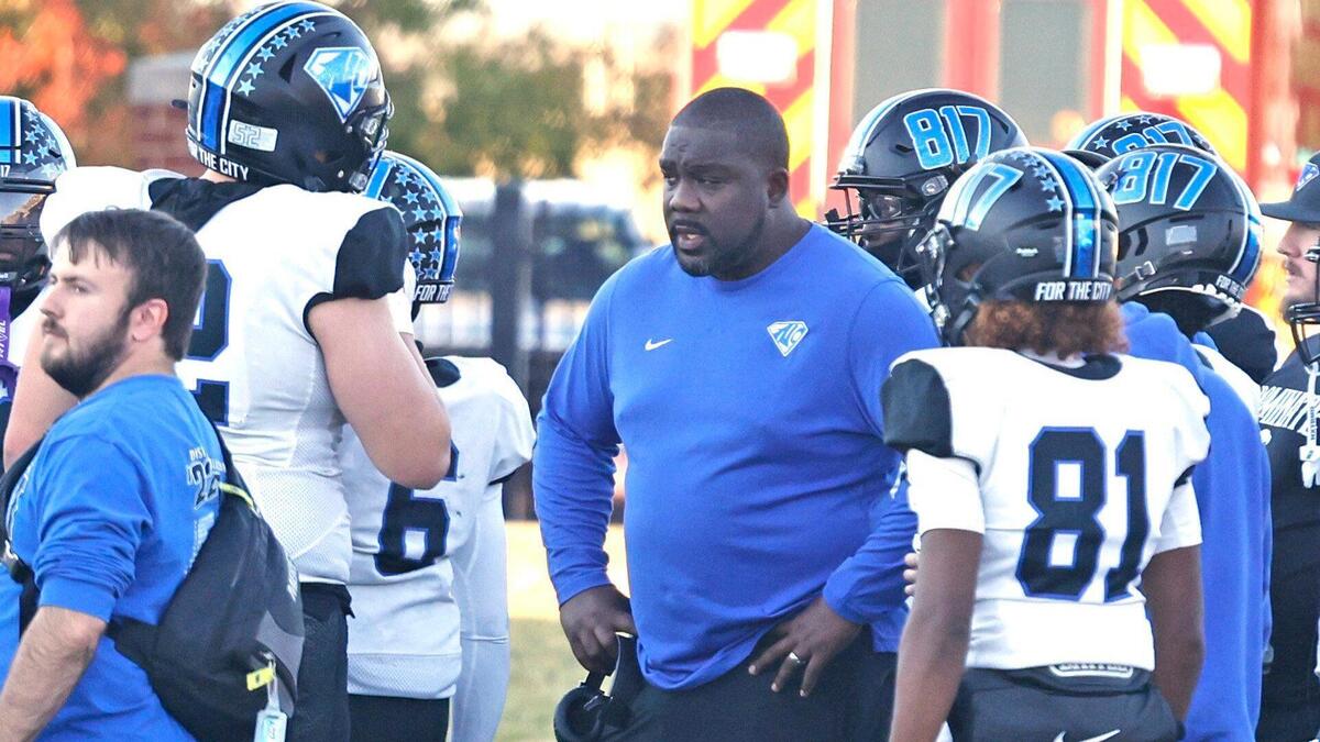 North Crowley head coach Ray Gates talks to players during a time out during the UIL District 6A D1 Regional football game at Vernon Newsom Stadium in Mansfield, Texas, Saturday, Nov. 30, 2024.